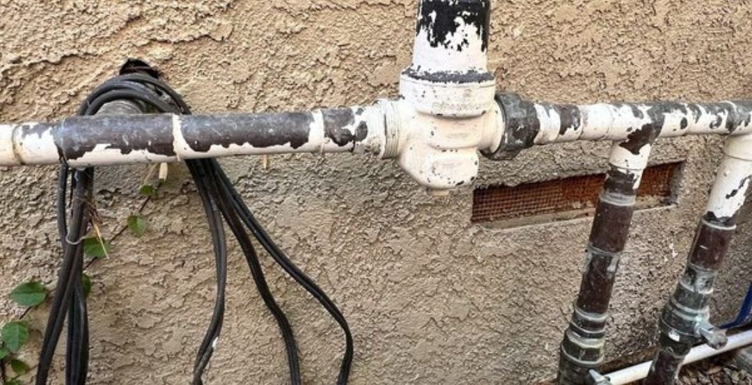 Main water shutoff valve and supply line at a home served by Best Coast Plumbing