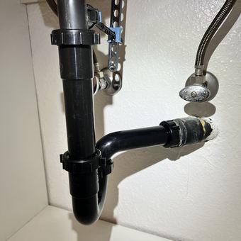 Fresh P-trap and drain assembly installed under a bathroom sink