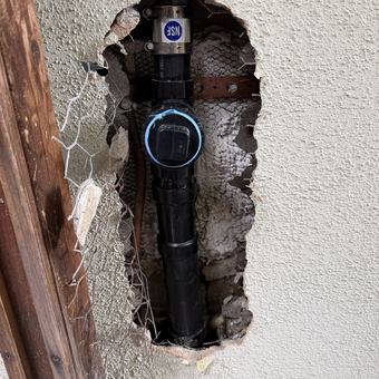 In-wall drain line repair with a new cleanout installed