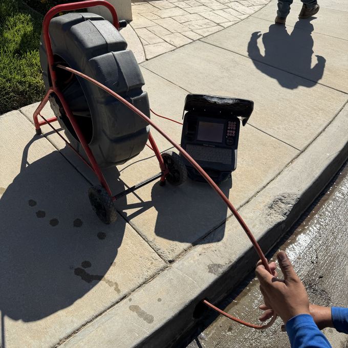 The camera reel and monitor at the curb for a drain line inspection in Granada Hills.