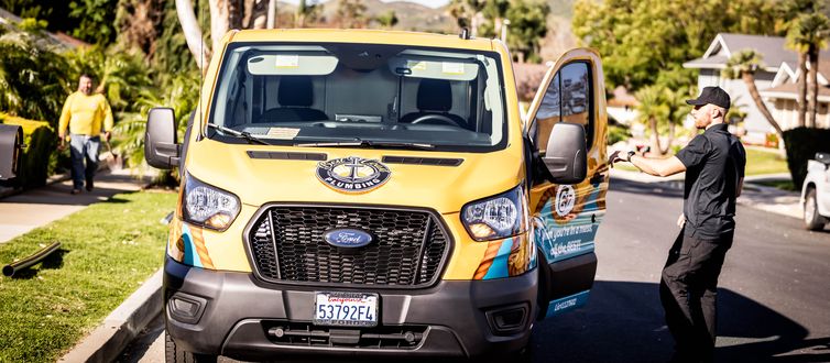 Best Coast Plumbing van arriving at a home for an emergency call